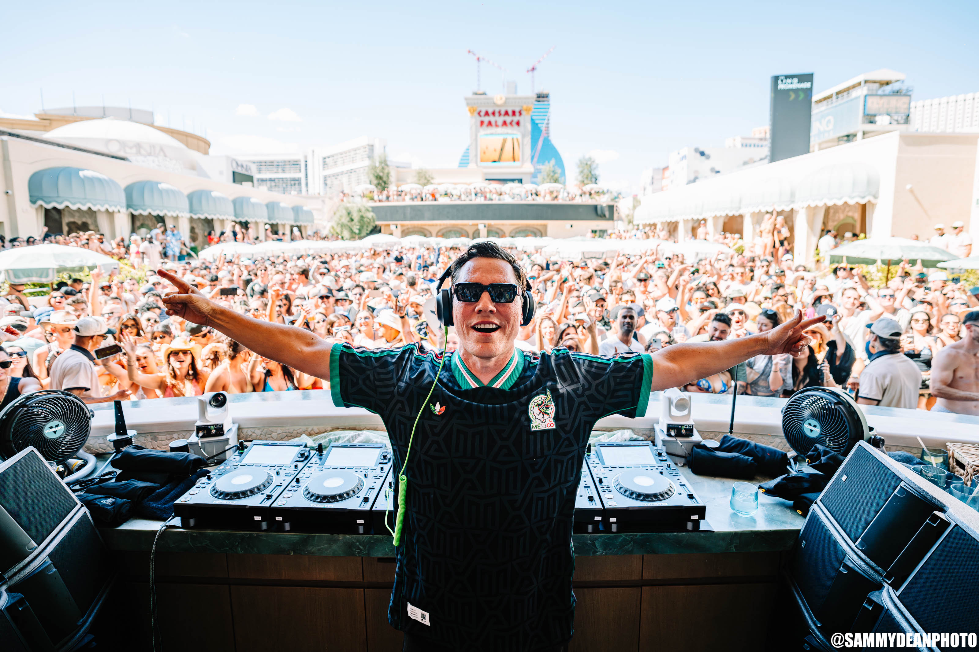 Tiësto with his arms raised at OMNIA Dayclub